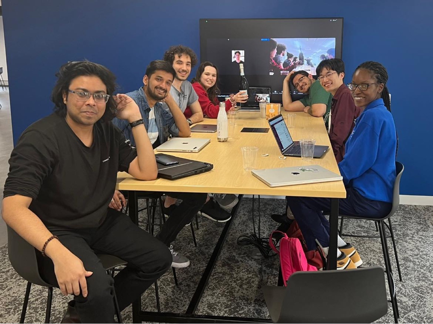 Mert mentoring alongside his lab-mates