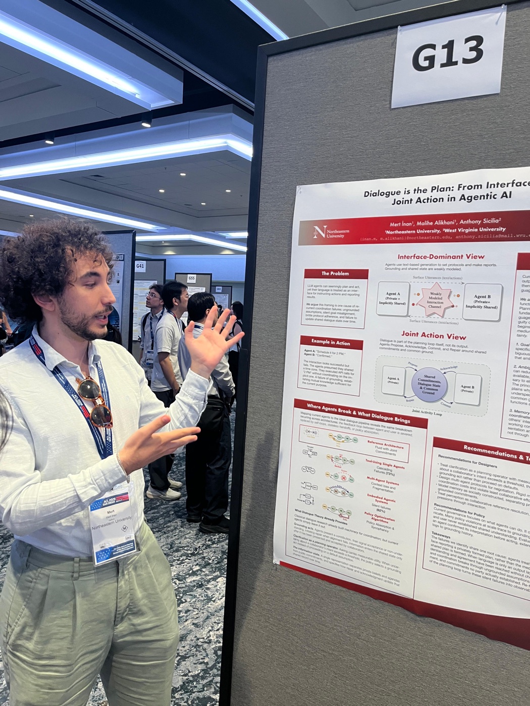 Mert explaining a research poster on agentic AI at ACL 2026