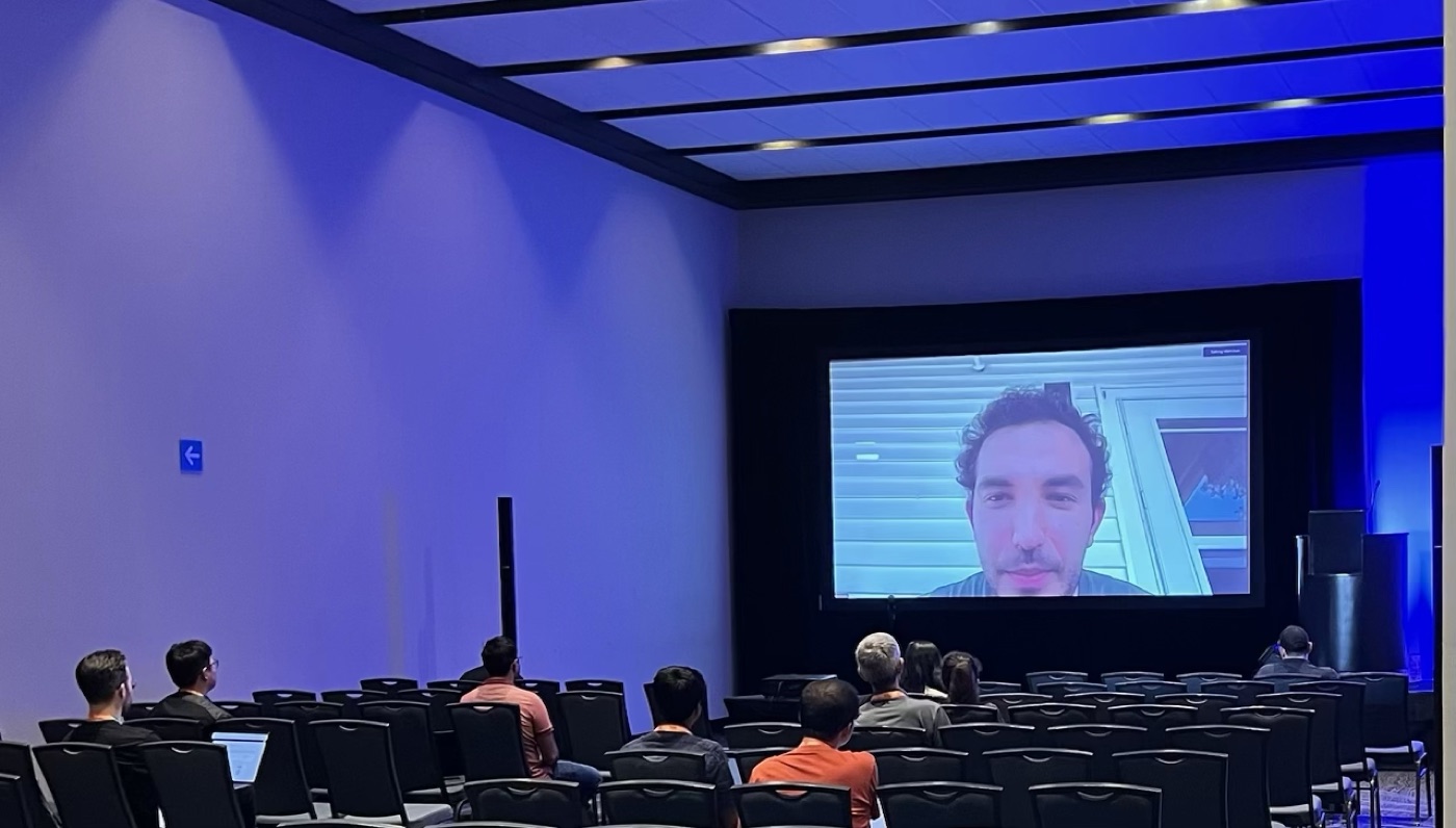 Mert presenting virtually to a conference audience